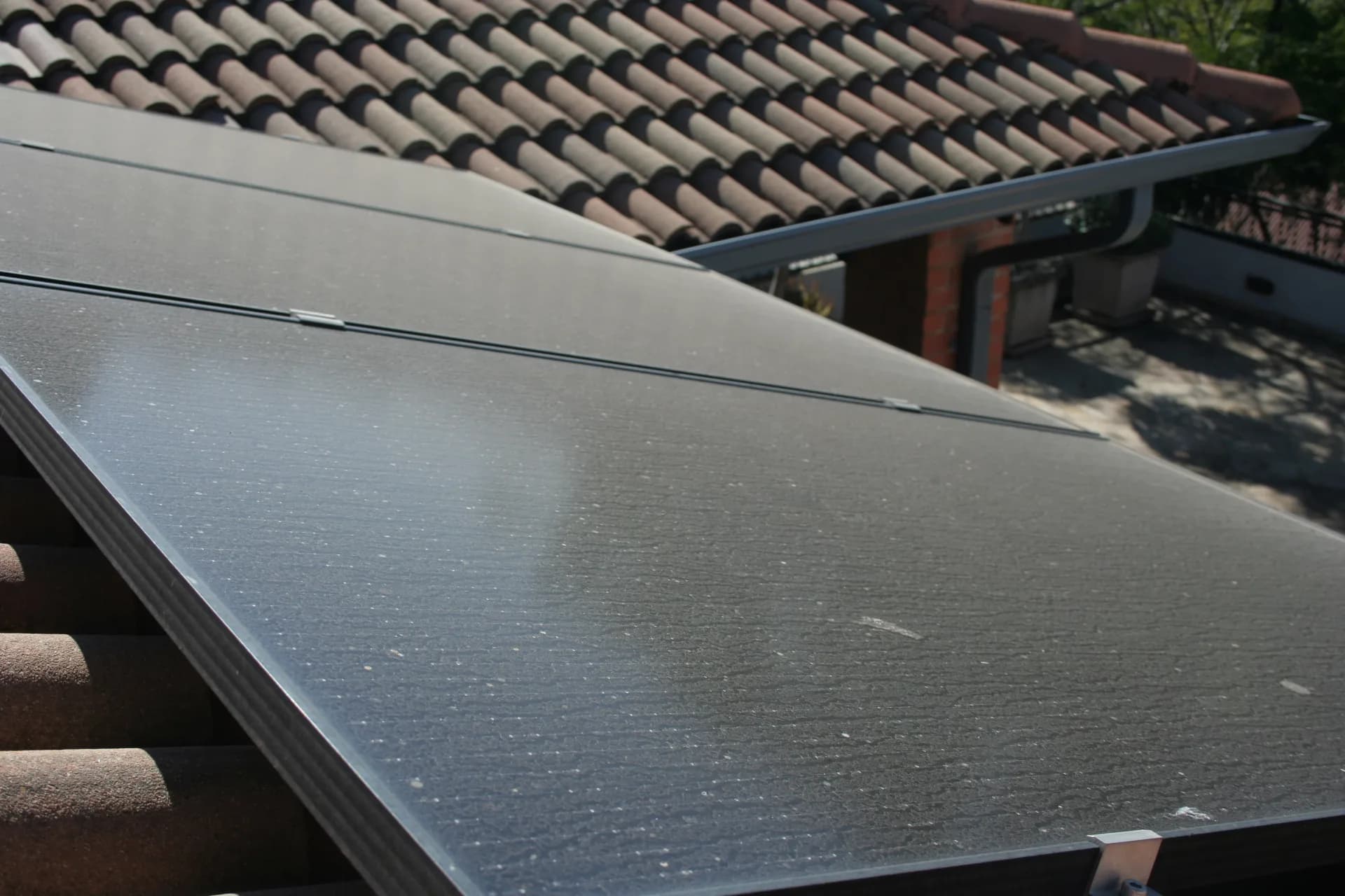 Solar panels coated in Highveld dust on a Pretoria tile roof — before a HelioClean visit